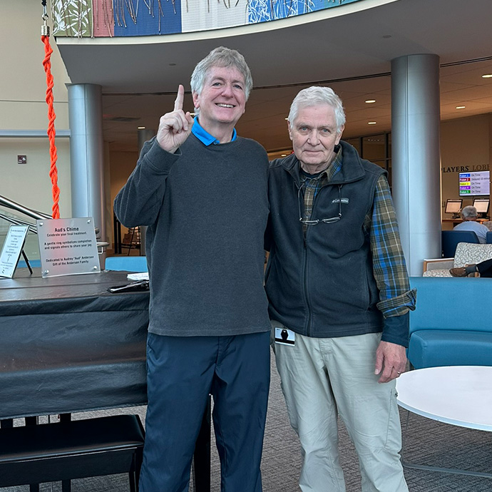 Prostate cancer survivor Michael D. and friend at chime ceremony