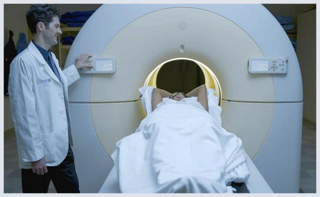 Doctor and Patient in Proton Therapy Treatment Room